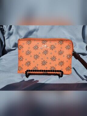 COACH Orange Floral Heart Zip Wristlet